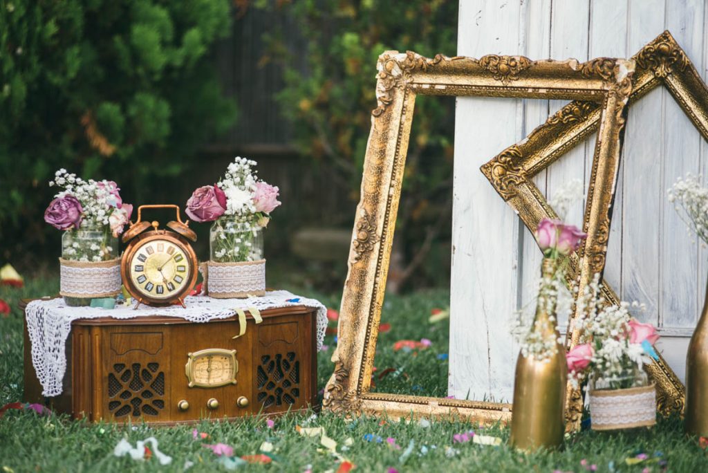 vintage wedding decorations sitting in a field